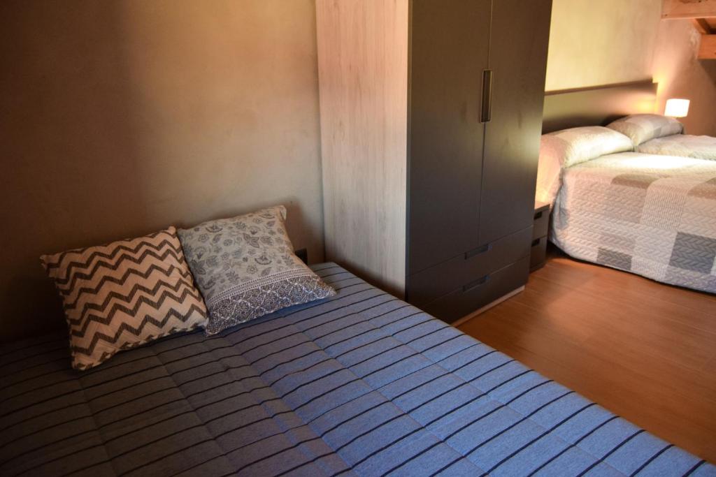 Postel nebo postele na pokoji v ubytování Casa Rural Martín