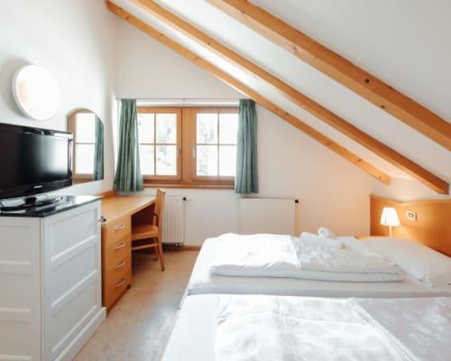 Letto o letti in una camera di Hotel Corno Bianco