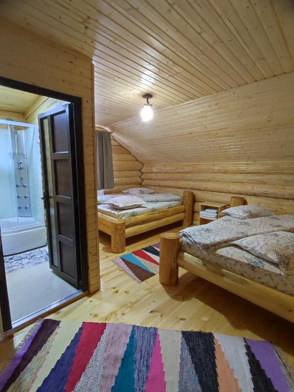 Postel nebo postele na pokoji v ubytování Cabana Colț De Munte