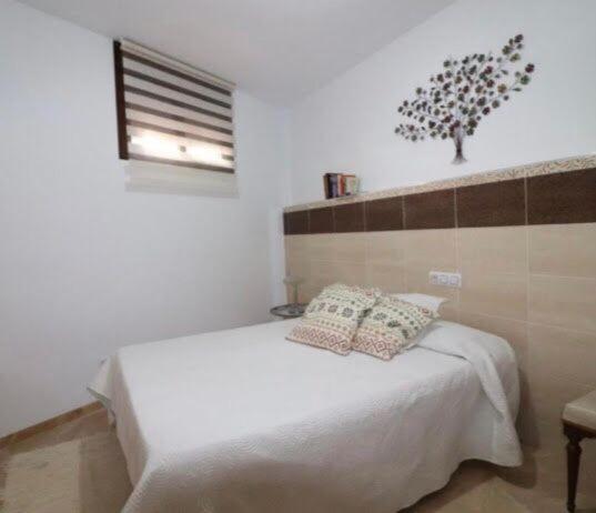Un ou plusieurs lits dans un hébergement de l'établissement Apartamento Navas