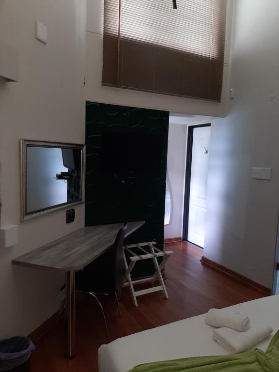 TV a/nebo společenská místnost v ubytování Lodge Bellagio