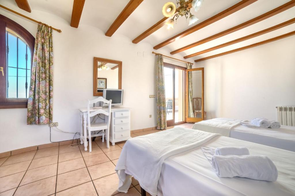 Postel nebo postele na pokoji v ubytování Villa Fuster - PlusHolidays