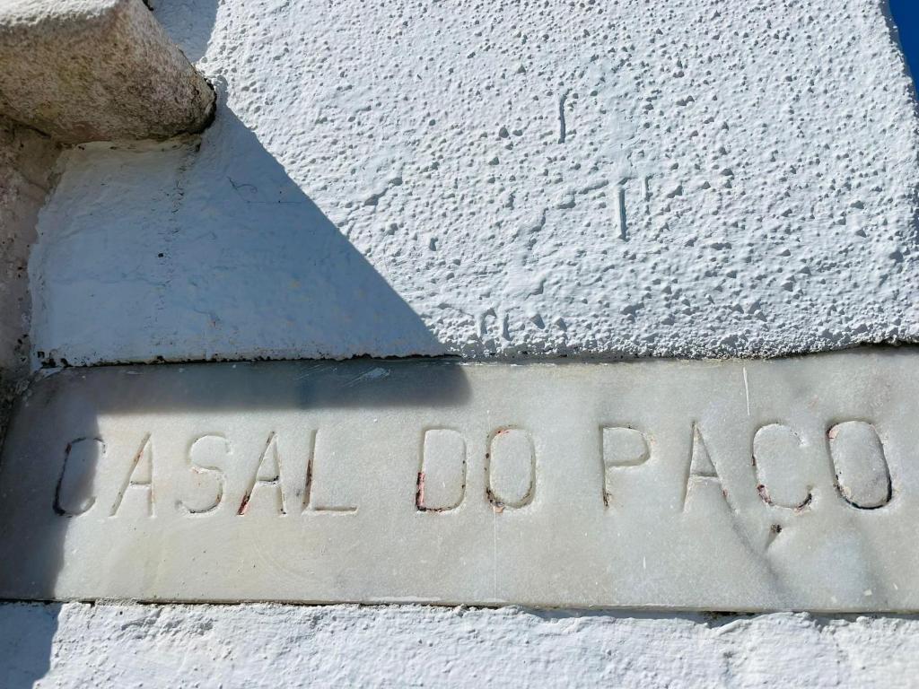 a stone sign on the side of a building at Paço Marmòris Field in Sintra
