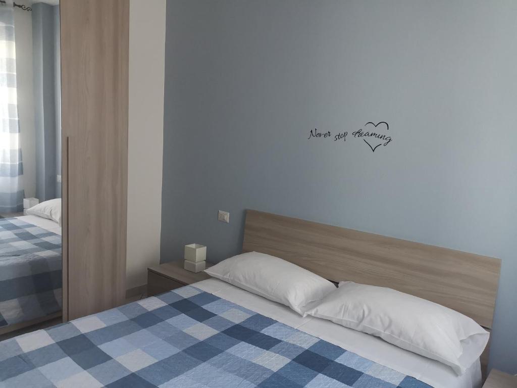 Postel nebo postele na pokoji v ubytování BeB I PORTICI