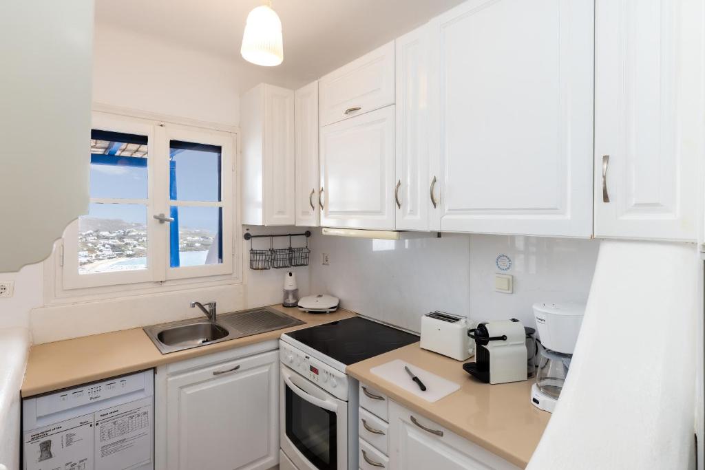 Kuchyň nebo kuchyňský kout v ubytování Mykonos Psarou Place