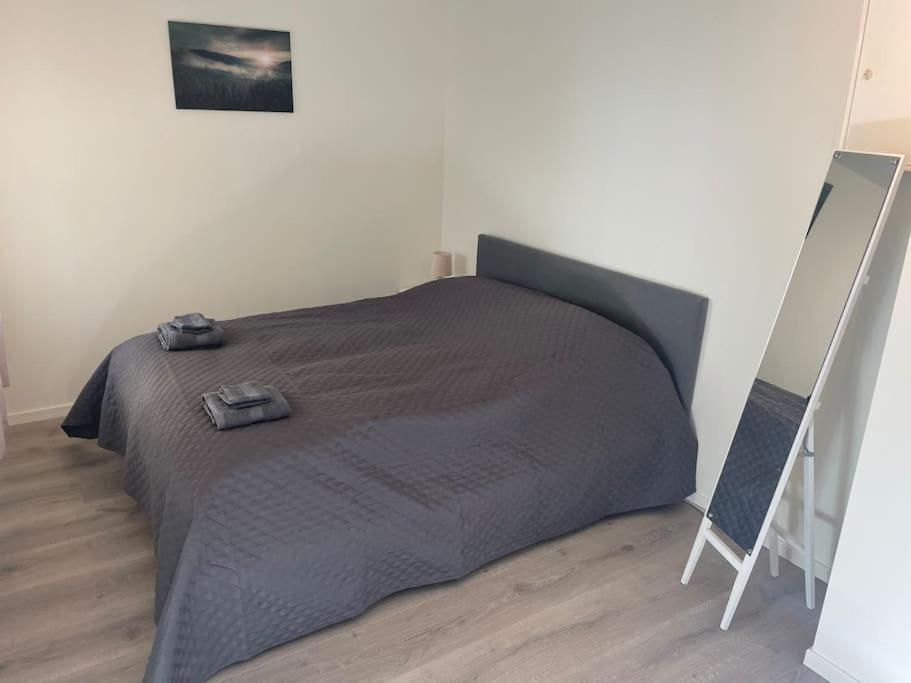 Voodi või voodid majutusasutuse Litle cozy apartment in Ålesund toas