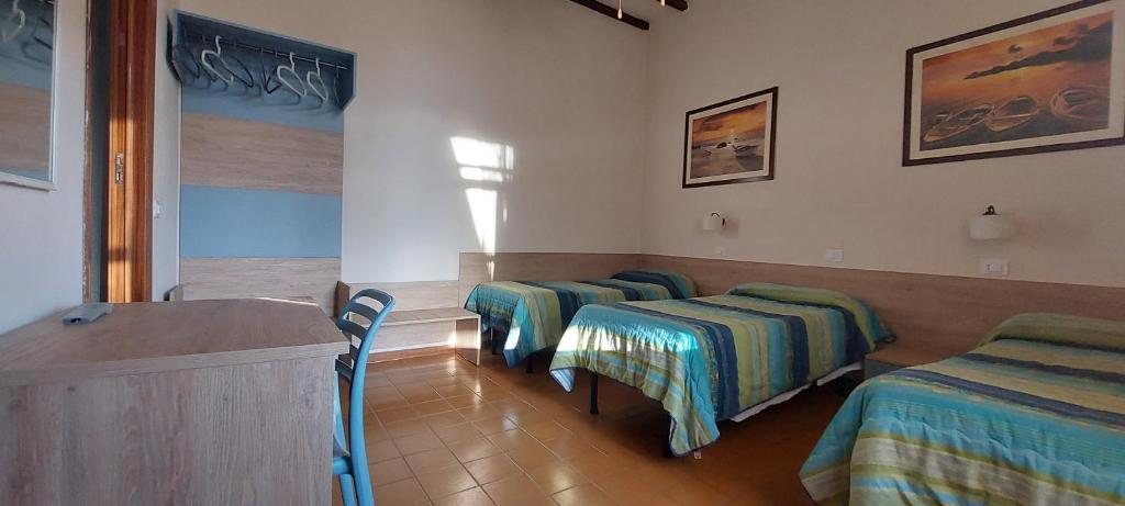 Postel nebo postele na pokoji v ubytování Hotel Lea