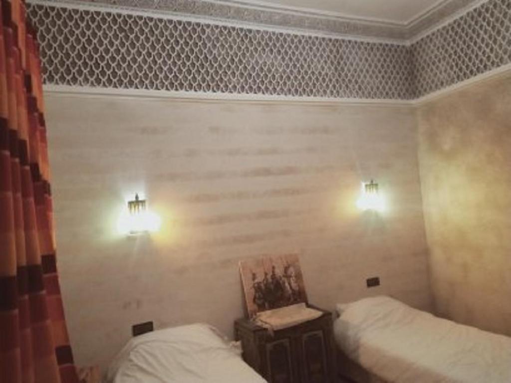 Postel nebo postele na pokoji v ubytování Riad Sidi Hicham