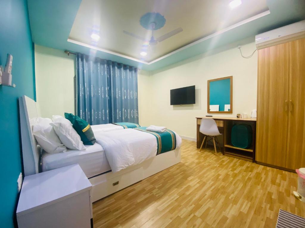 TV a/nebo společenská místnost v ubytování Hedheykuri Residence Fuvahmulah