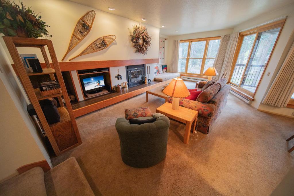 a living room with a couch and a fireplace at Quicksilver 1672 in Keystone