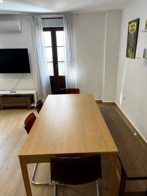 Televízia a/alebo spoločenská miestnosť v ubytovaní ANGELFLAT CENTRO
