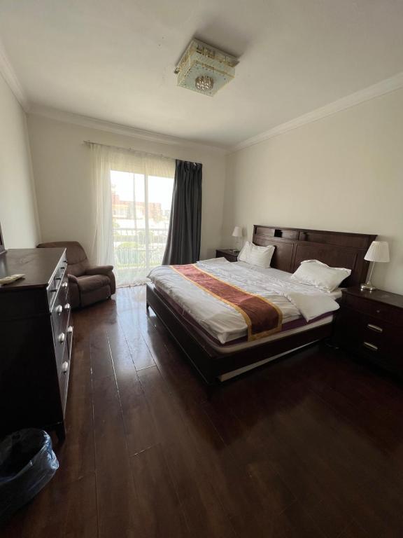 a bedroom with a large bed and a window at درة العروس فخامة فان بيتش in Durat  Alarous