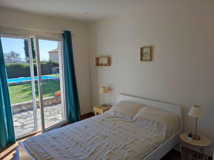 Posteľ alebo postele v izbe v ubytovaní Villa Olivaie St Ange