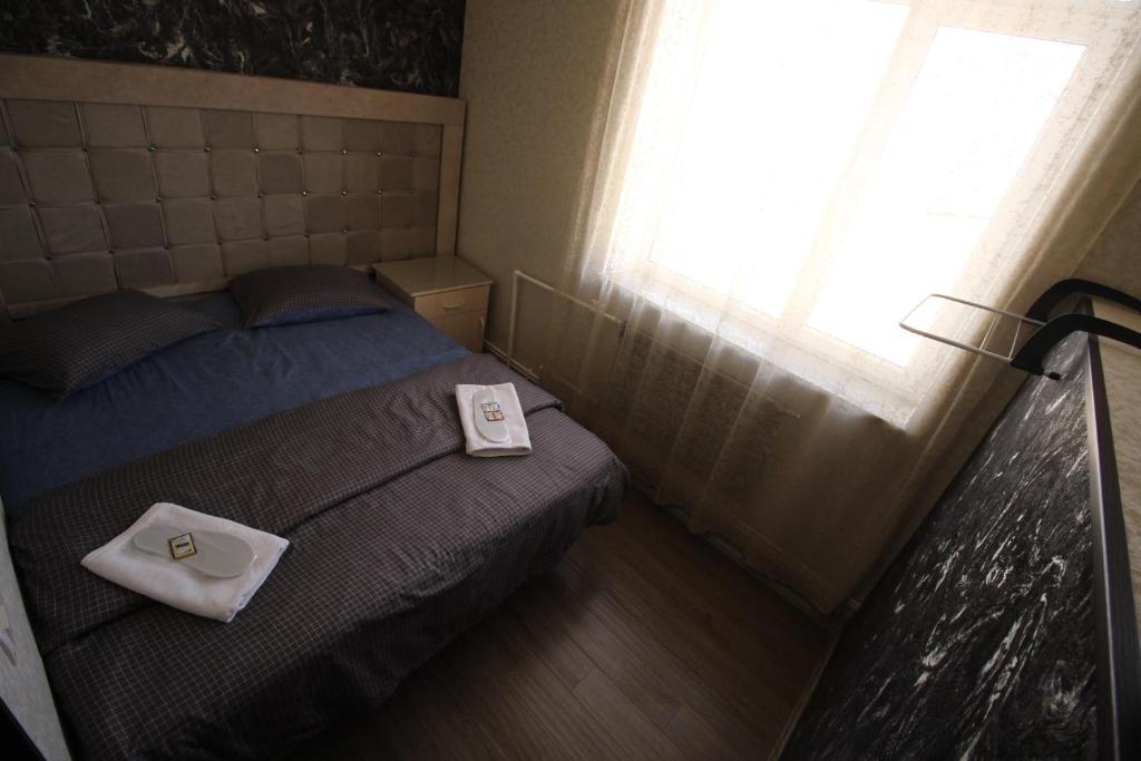 Postel nebo postele na pokoji v ubytování Oazis