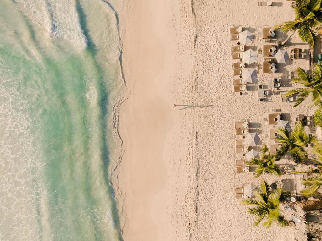 an overhead view of the beach and the ocean at Chiringuito Tulum in Tulum