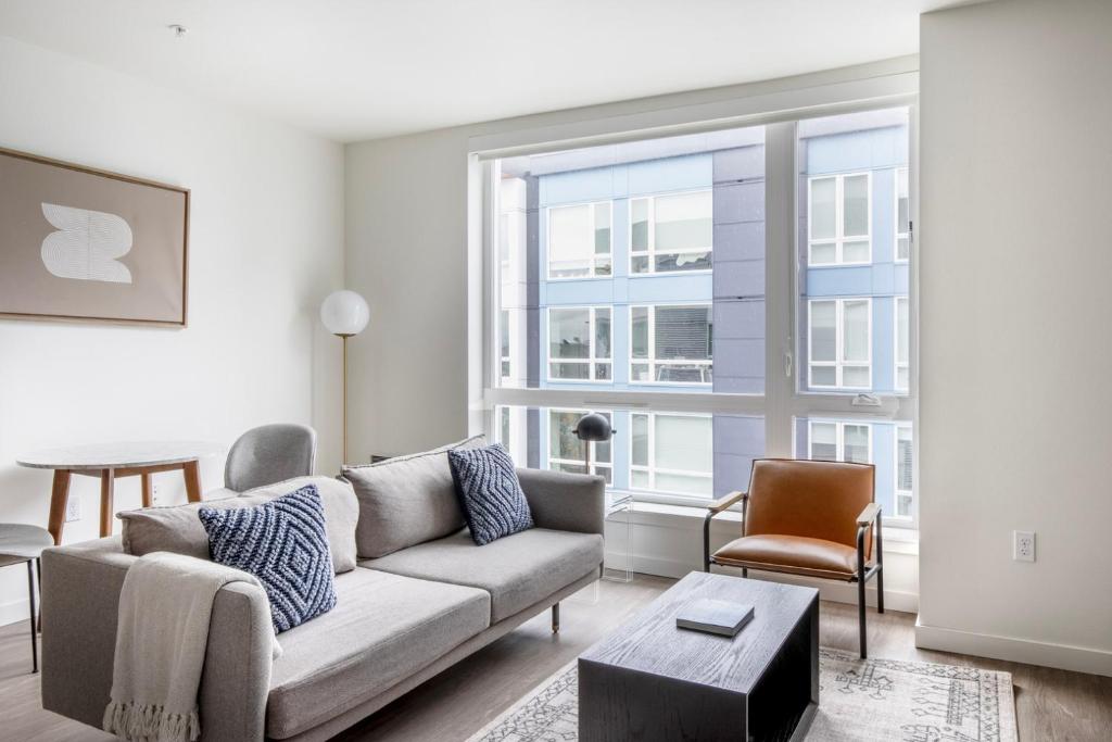 a living room with a couch and a table at First Hill 1br w gym lounge nr soccer field SEA-542 in Seattle
