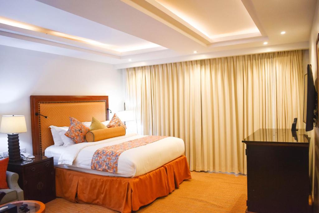 Postel nebo postele na pokoji v ubytování Cap Kivu Hôtel
