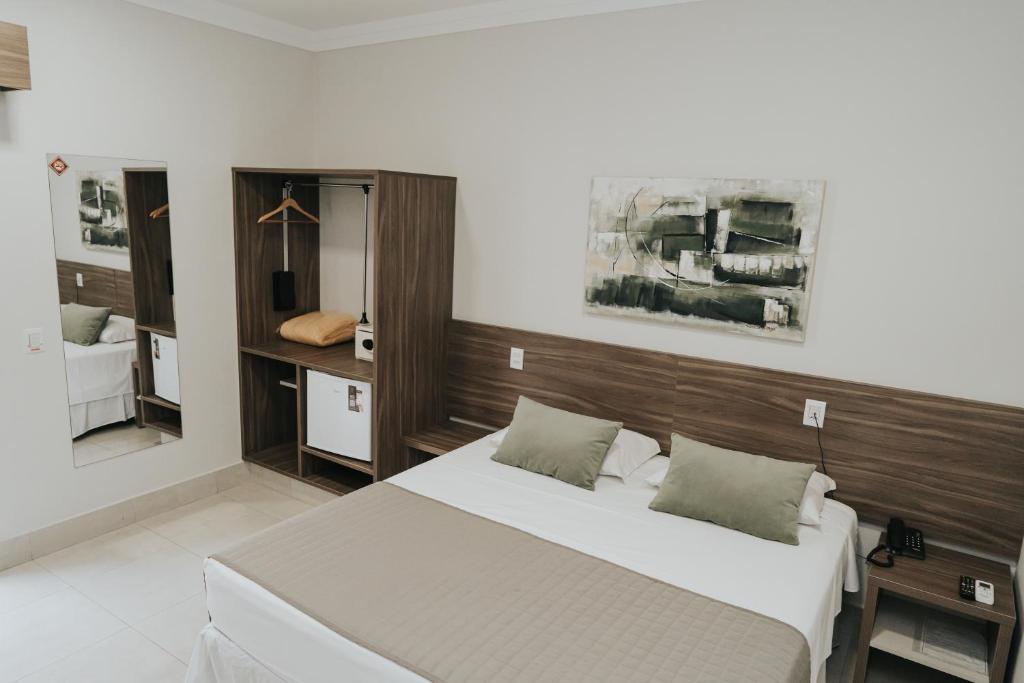 Postel nebo postele na pokoji v ubytování Portal Hotel Mogi Mirim