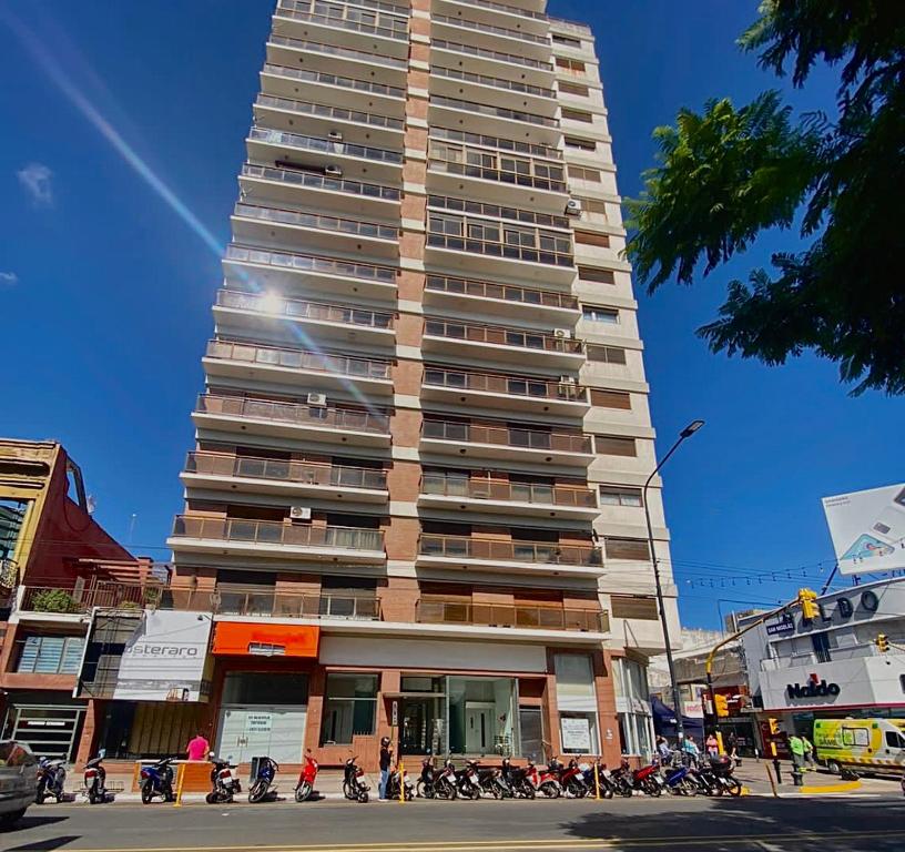 a tall building with motorcycles parked in front of it at Depto cómodo, ubicación perfecta in Pergamino