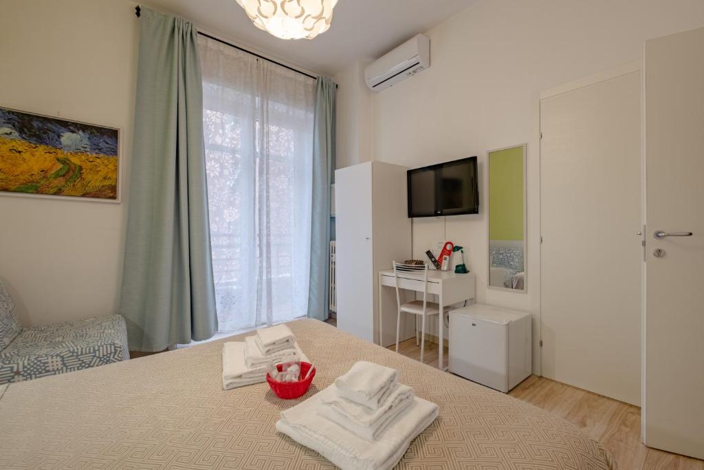 TV a/nebo společenská místnost v ubytování Damiani & Sister Guesthouse