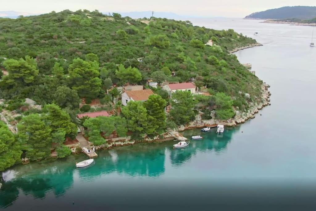 an aerial view of an island with boats in the water at Perina Haven - Island Vis Beachfront in Rogačić