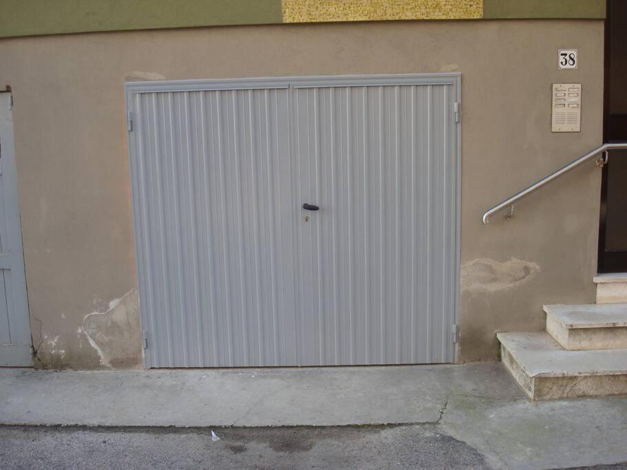 a large metal door on the side of a building at Daniele's flat in Venice Mestre in Mestre
