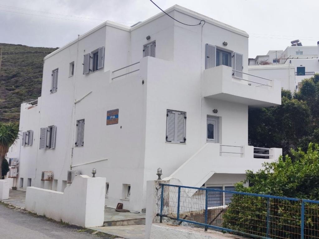 a white building with stairs in front of it at Panana Irida in Mérikhas