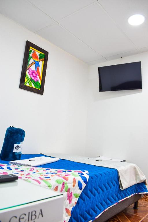 Postel nebo postele na pokoji v ubytování Ayenda Ceiba Rooms