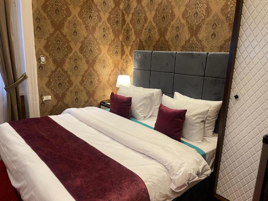 Postel nebo postele na pokoji v ubytování Cairo Inn
