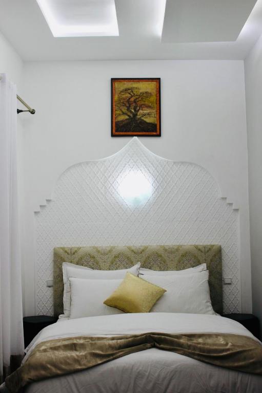 Postel nebo postele na pokoji v ubytování DAR Riad Jomana