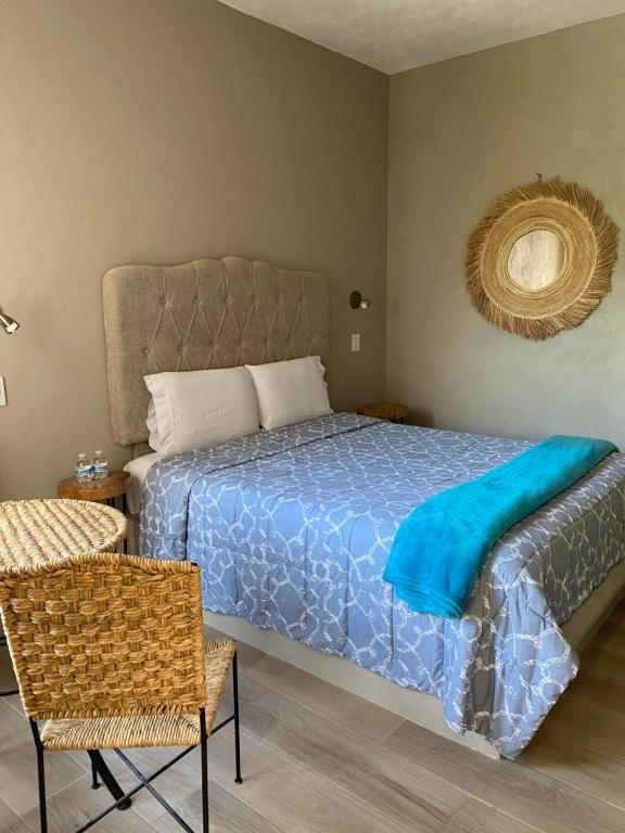 Postel nebo postele na pokoji v ubytování Hotel Casa Caro