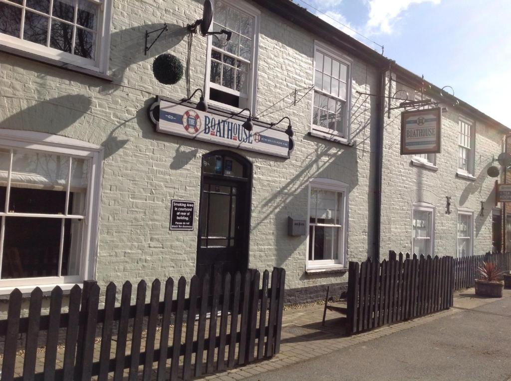 a building with a sign on the side of it at The Boathouse in Sutton Bridge