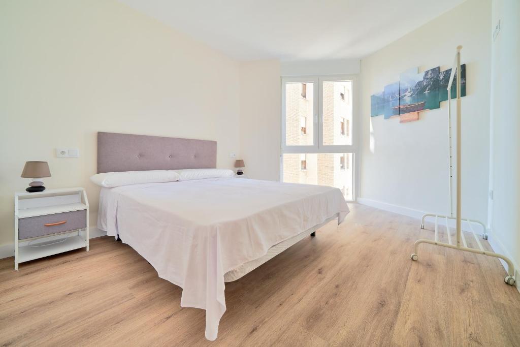 Łóżko lub łóżka w pokoju w obiekcie Impresionante apartamento en Playa de la Malagueta