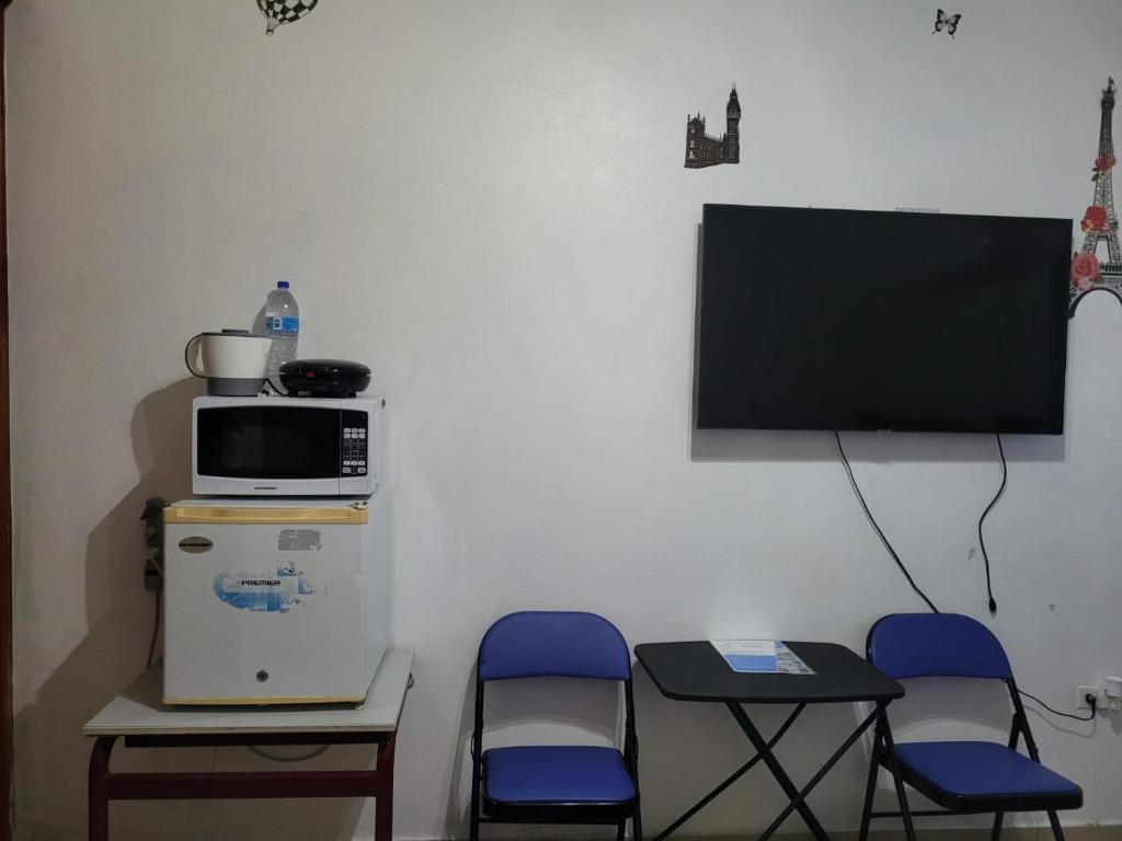 TV a/nebo společenská místnost v ubytování Sky Blue Residence