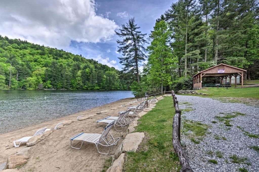 a group of chairs sitting on the shore of a lake at Stunning Sapphire Valley Resort Townhome with Perks! in Sapphire