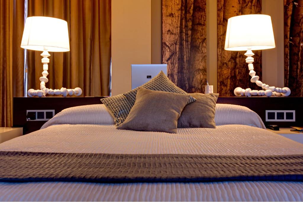 Postel nebo postele na pokoji v ubytování Hotel Las Terrazas & Suite