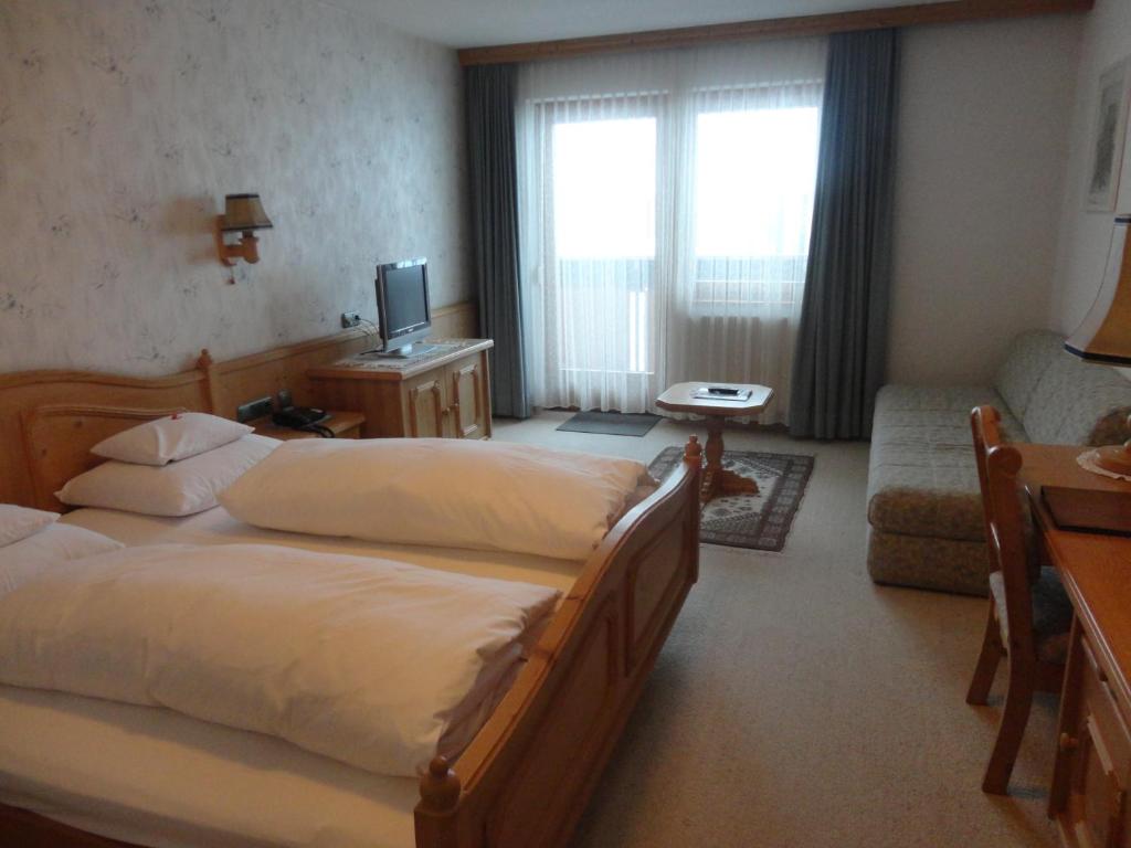 Postel nebo postele na pokoji v ubytování Haus Alpina