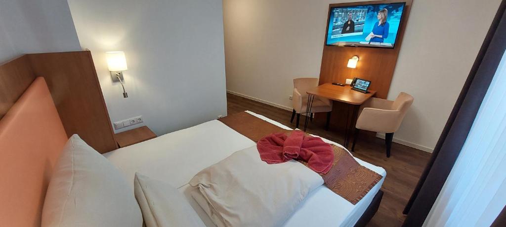 Postel nebo postele na pokoji v ubytování Hotel Amber Altstadt