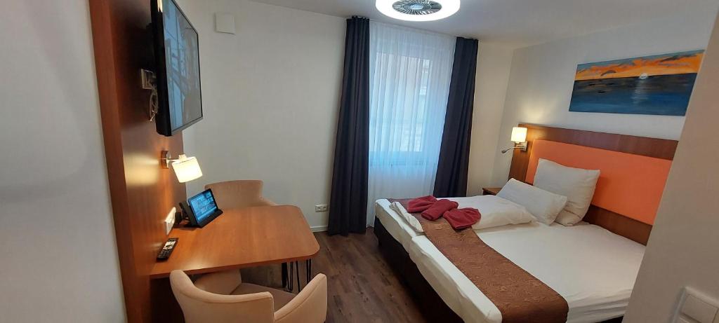 Postel nebo postele na pokoji v ubytování Hotel Amber Altstadt