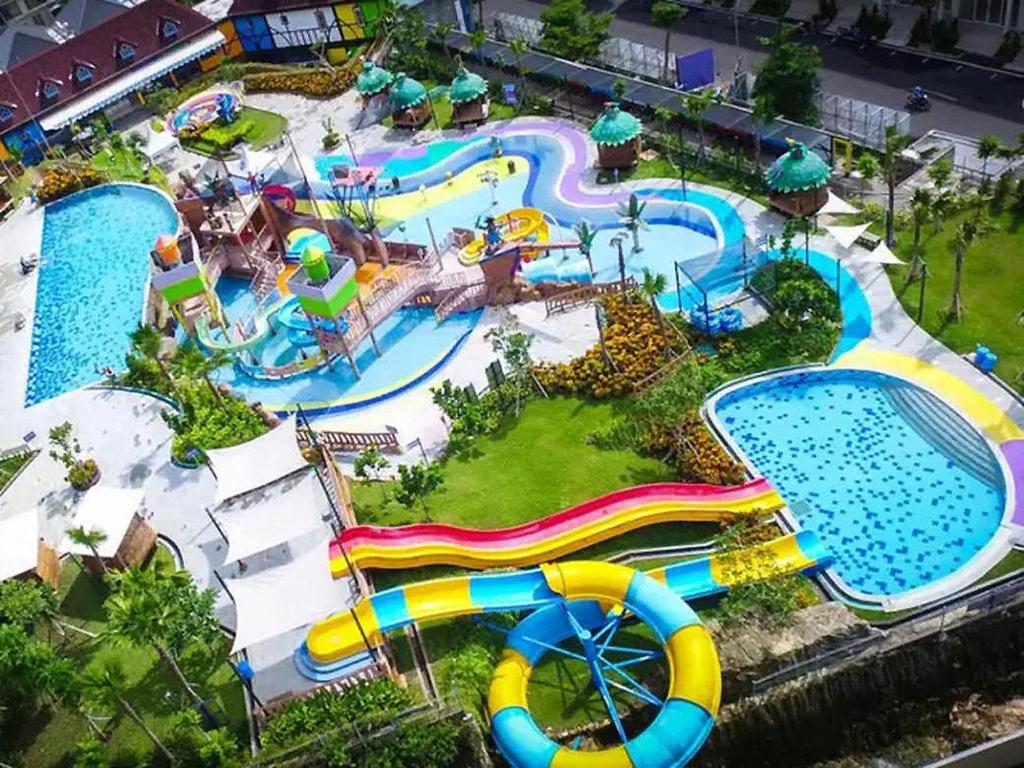 an aerial view of a water park with a water slide at Mutiara Balecatur Guest House in Yogyakarta
