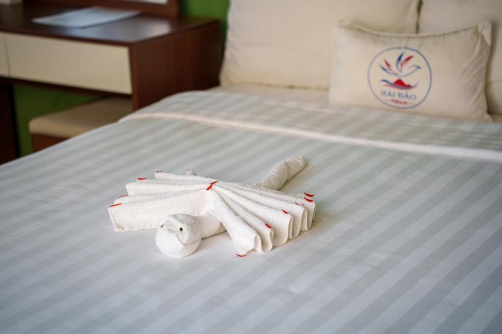 Postel nebo postele na pokoji v ubytování HAI DAO HOI AN VILLA