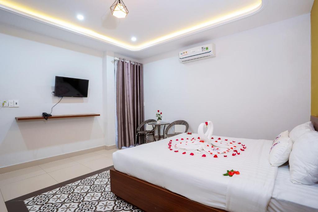 Postel nebo postele na pokoji v ubytování HAI DAO HOI AN VILLA