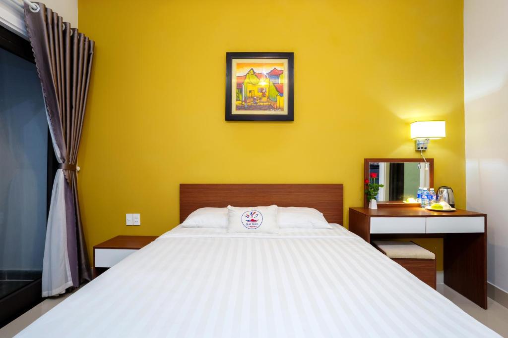 Giường trong phòng chung tại HAI DAO HOI AN VILLA