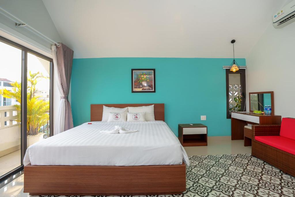 Giường trong phòng chung tại HAI DAO HOI AN VILLA