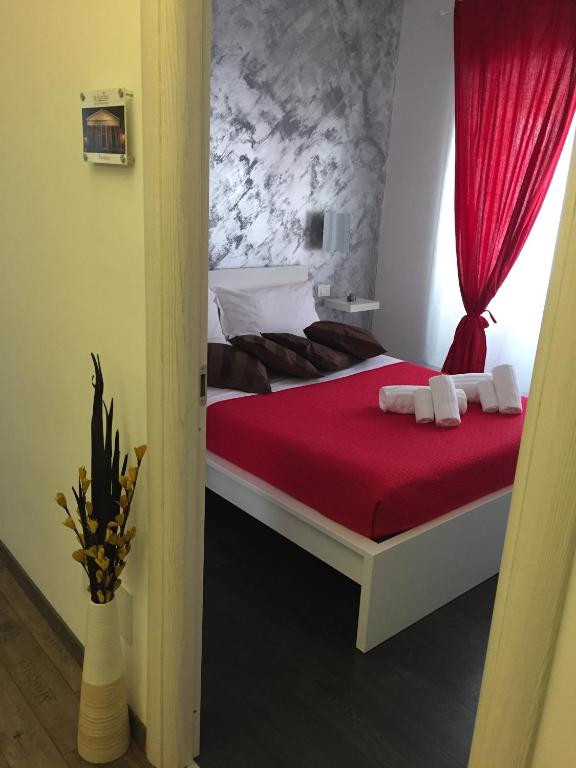 A bed or beds in a room at De Guestibus