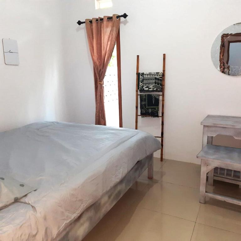 Postel nebo postele na pokoji v ubytování rindoe jogja holiday home