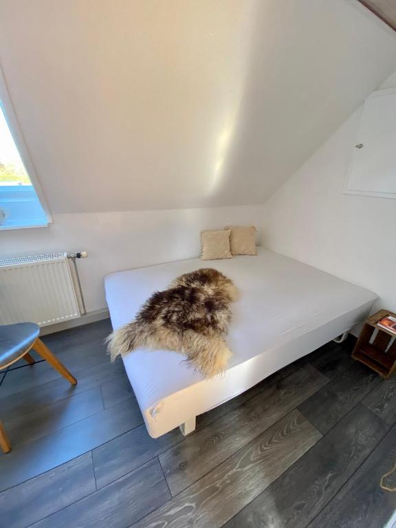 Postel nebo postele na pokoji v ubytování feriehus med havudsigt