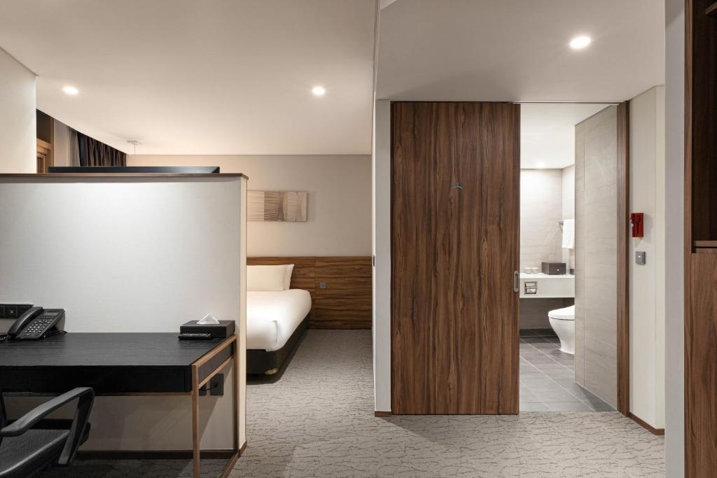 Postel nebo postele na pokoji v ubytování Staz Hotel Ulsan