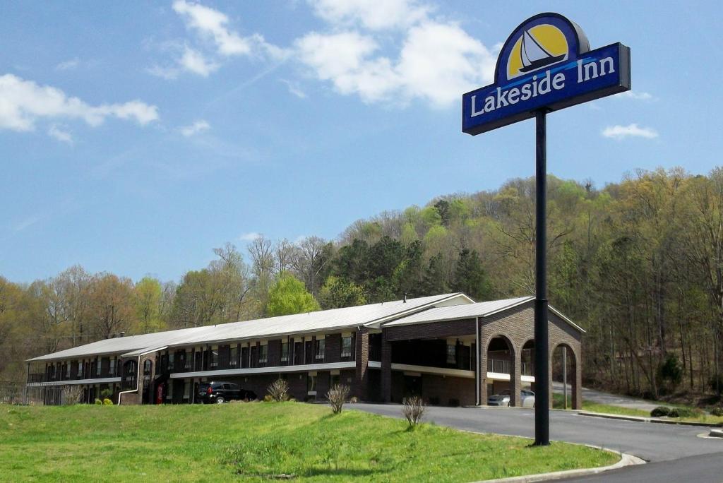 a large building with a sign in front of it at Lakeside Inn in Guntersville