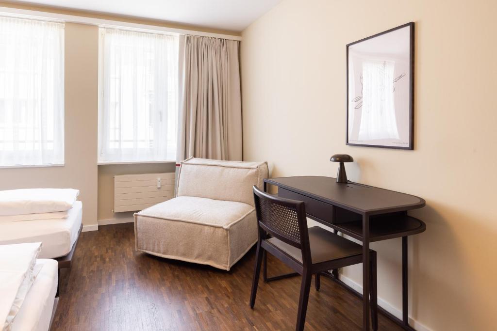 Postel nebo postele na pokoji v ubytování EMA House Serviced Apartments Superior Seefeld